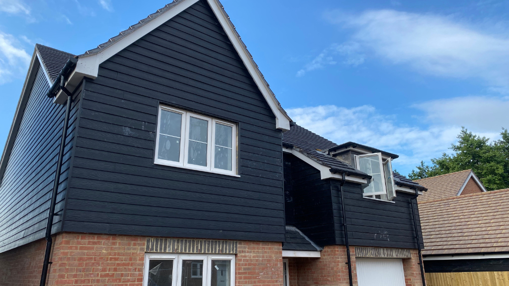 Black PVC cladding installed on the exterior of a house
