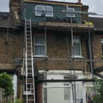 The roof of a house is undergoing a new roof installation.