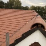 A house with a new roof that has been re-tiled.
