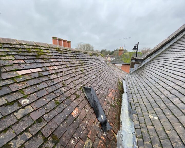 A view of a flat roof with a broken tile.