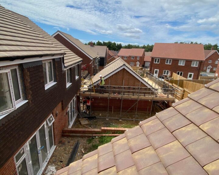 A view from the roof of a house undergoing new roof construction.