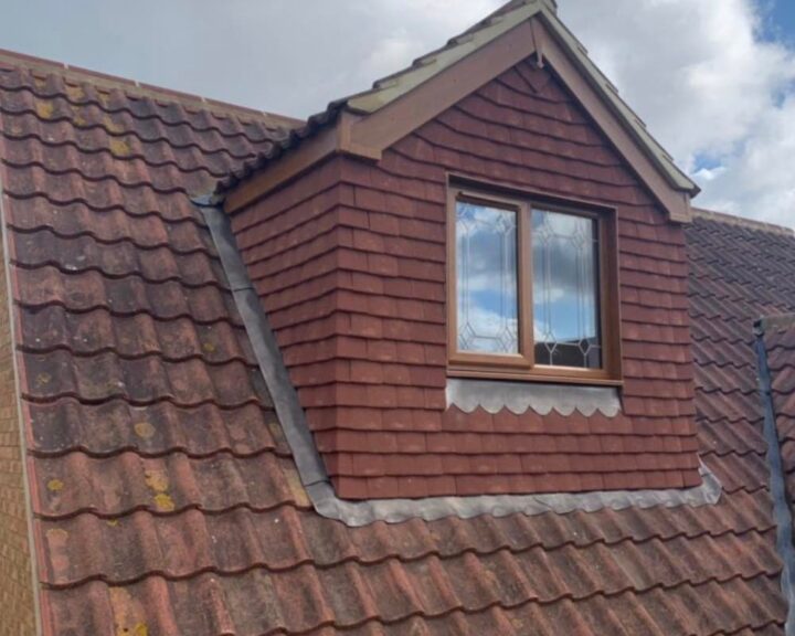 A new roof with a red tiled roof.